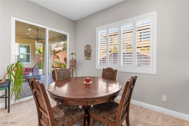 tiled dining room with ceiling fan