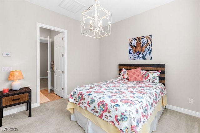 carpeted bedroom with a chandelier