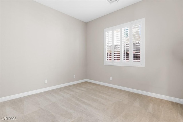 unfurnished room with light carpet