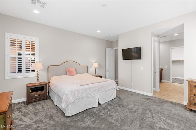 bedroom with a spacious closet, a closet, and carpet flooring