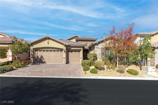 mediterranean / spanish-style house featuring a garage