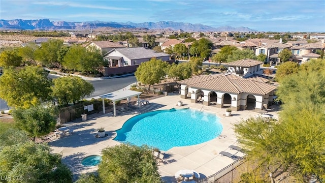 view of pool featuring a patio area and a mountain view