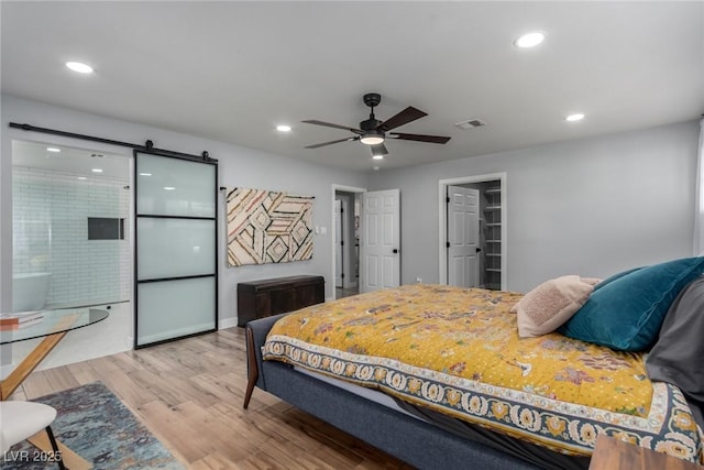 bedroom featuring ceiling fan and light hardwood / wood-style floors