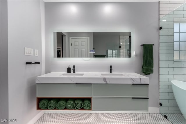 bathroom featuring a bath, tile patterned floors, and vanity