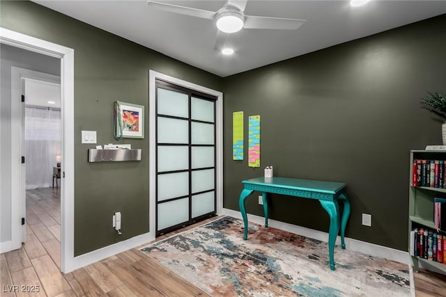 interior space with ceiling fan and light wood-type flooring