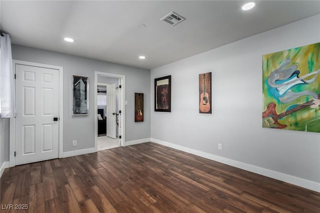 unfurnished room with hardwood / wood-style floors