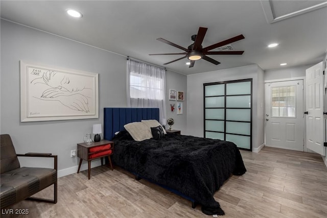 bedroom with light wood-type flooring and ceiling fan