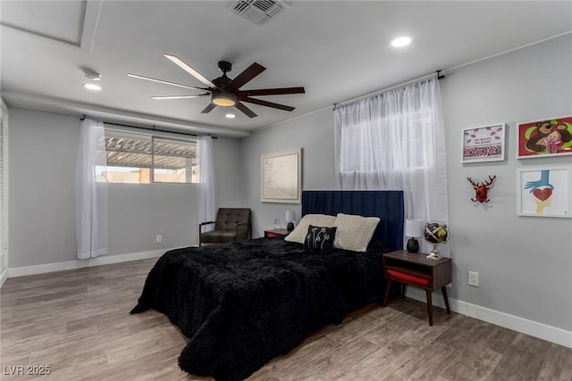 bedroom featuring light wood-type flooring and ceiling fan