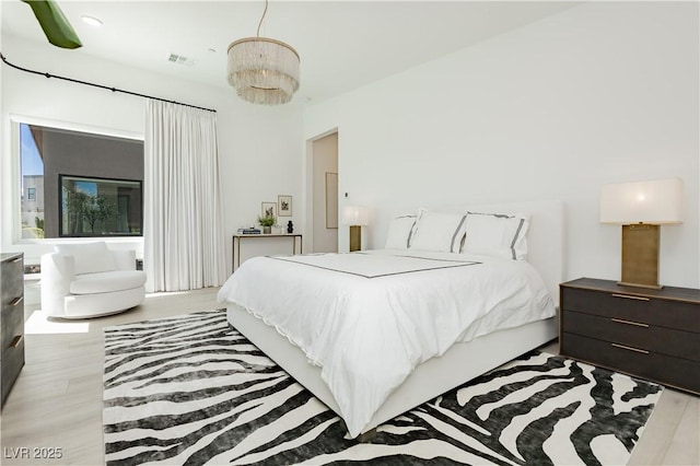 bedroom featuring light hardwood / wood-style floors