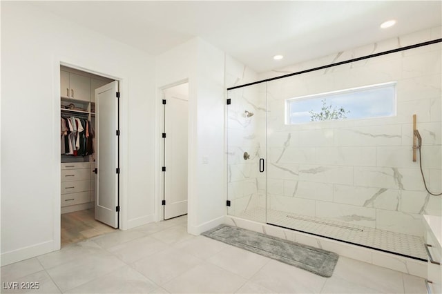 bathroom with a shower with door