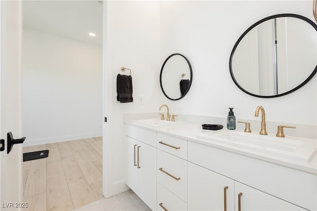 bathroom featuring hardwood / wood-style floors and vanity