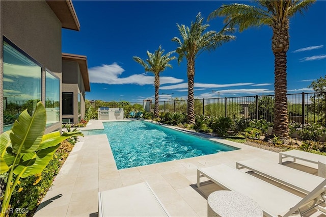 view of swimming pool featuring a patio