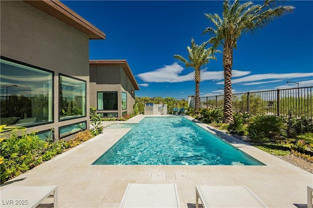 view of swimming pool featuring a patio