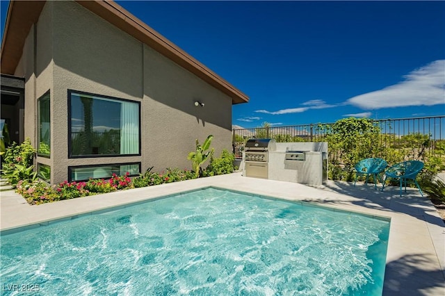 view of pool featuring a grill, a patio, and area for grilling