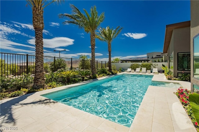 view of swimming pool featuring a patio area