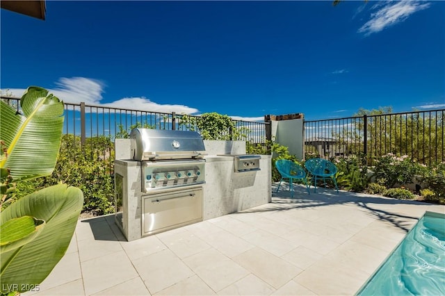 view of patio / terrace featuring exterior kitchen