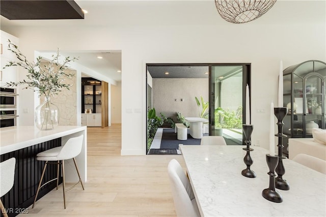 dining area with light wood-type flooring