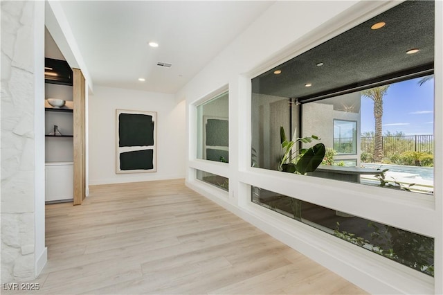 hallway featuring light wood-type flooring