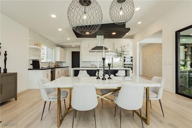 dining space featuring light hardwood / wood-style floors