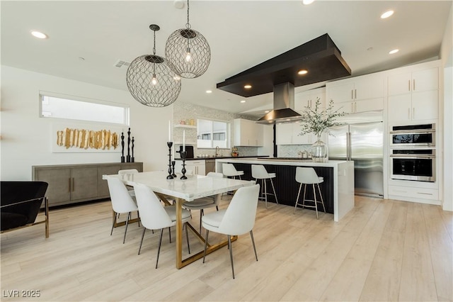 dining room with light wood-type flooring