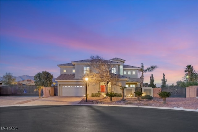 mediterranean / spanish house featuring a garage