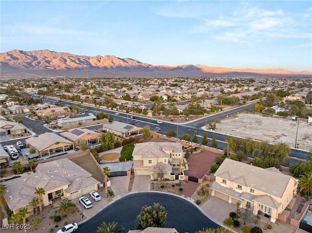 birds eye view of property with a mountain view