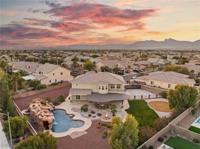 aerial view at dusk with a mountain view