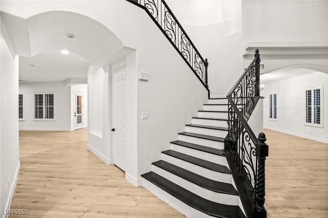 stairs with hardwood / wood-style floors