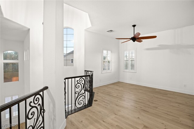 interior space featuring ceiling fan and light hardwood / wood-style flooring