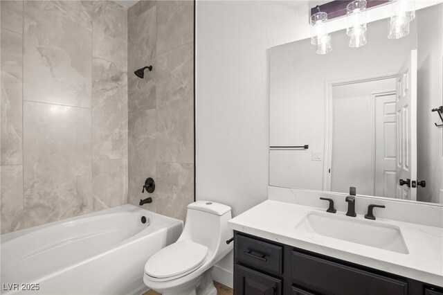 full bathroom with tiled shower / bath combo, vanity, and toilet