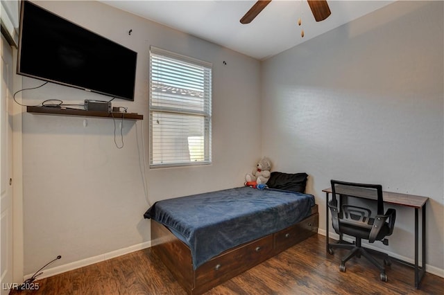 bedroom with dark wood-type flooring, ceiling fan, and vaulted ceiling