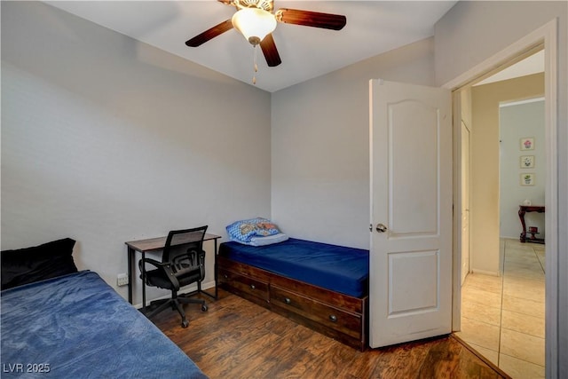 bedroom featuring ceiling fan and dark hardwood / wood-style flooring