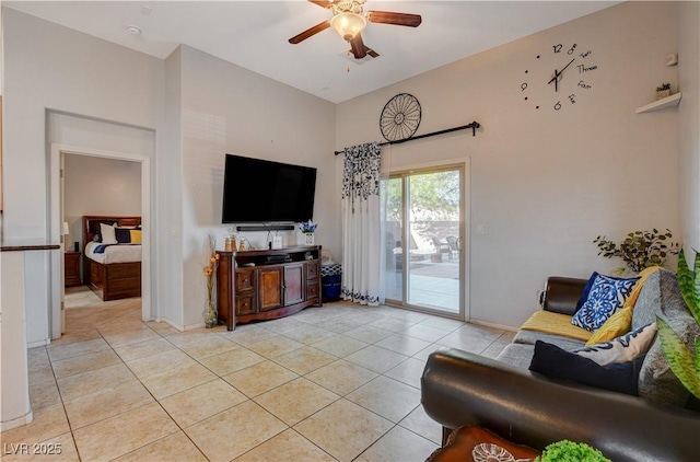 living room with ceiling fan and light tile patterned flooring