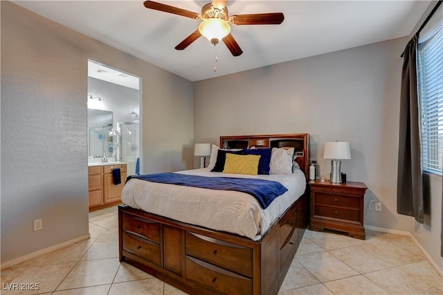 bedroom with ensuite bath, light tile patterned floors, and ceiling fan