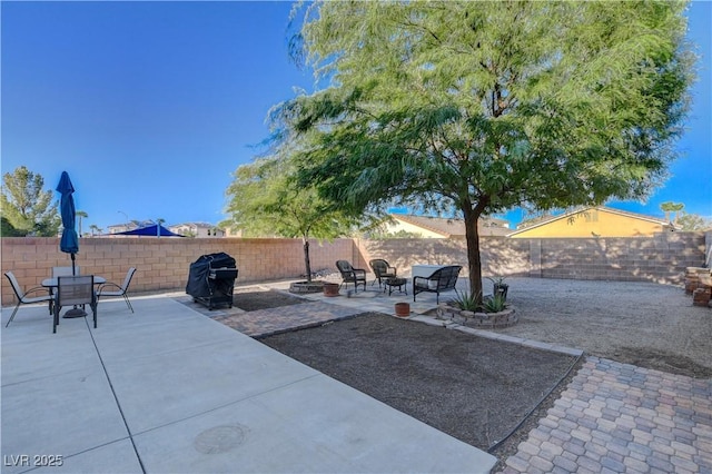 view of patio with a grill