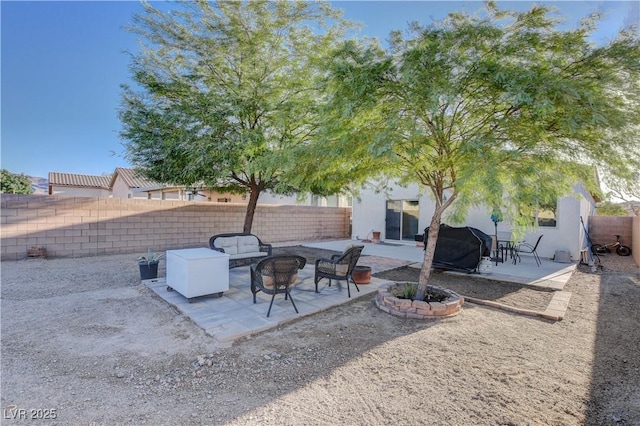 view of patio / terrace featuring an outdoor fire pit