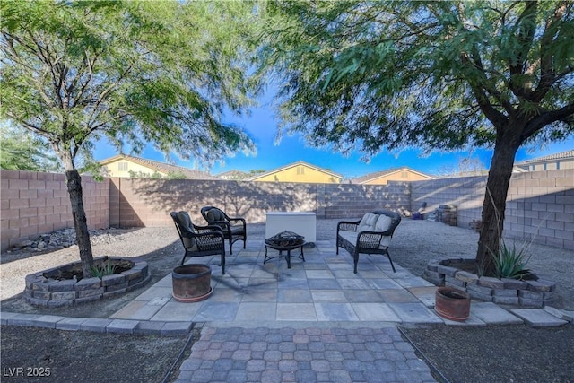 view of patio / terrace with an outdoor fire pit