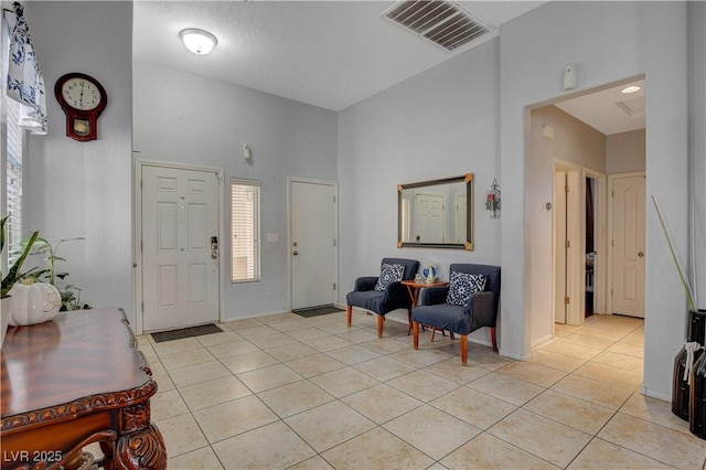 entryway with light tile patterned floors