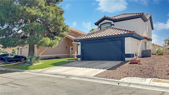 view of front of property with cooling unit and a garage