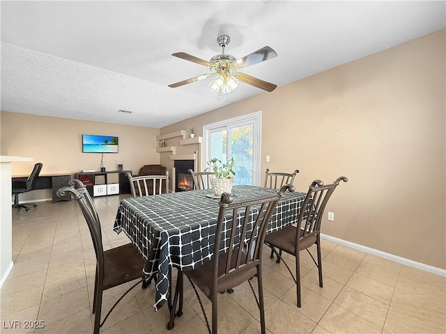 3350 Stacey Lyn Dr, Las Vegas, NV 89117 - dining room with ceiling fan, a textured ceiling, and light tile patterned flooring