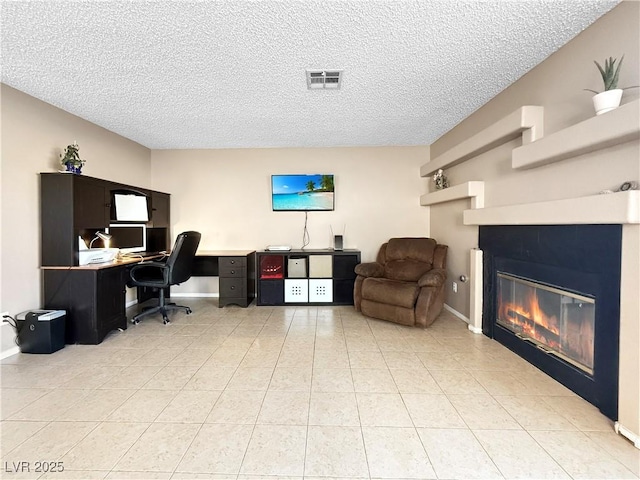 3350 Stacey Lyn Dr, Las Vegas, NV 89117 - office space with a textured ceiling, a tile fireplace, and light tile patterned flooring