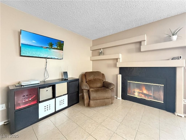 3350 Stacey Lyn Dr, Las Vegas, NV 89117 - sitting room featuring a tiled fireplace, a textured ceiling, and light tile patterned floors