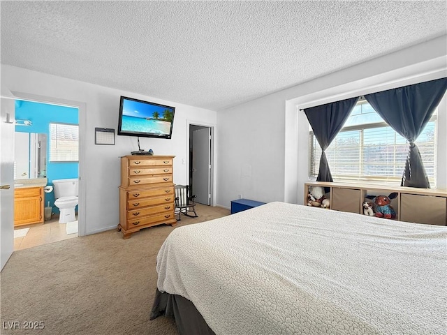 3350 Stacey Lyn Dr, Las Vegas, NV 89117 - bedroom featuring light colored carpet, multiple windows, ensuite bathroom, and a textured ceiling