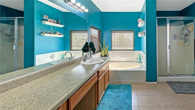 3350 Stacey Lyn Dr, Las Vegas, NV 89117 - bathroom with tile patterned floors, vanity, and shower with separate bathtub