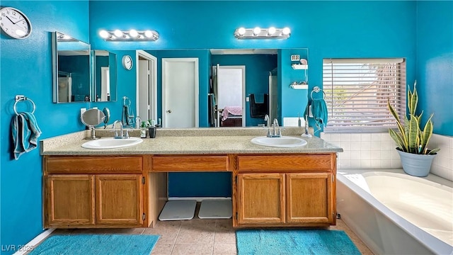 3350 Stacey Lyn Dr, Las Vegas, NV 89117 - bathroom with a bathtub, vanity, and tile patterned flooring