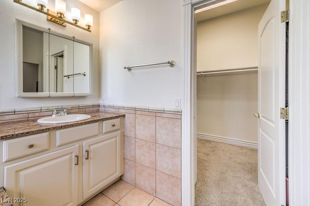 bathroom with vanity and tile patterned flooring