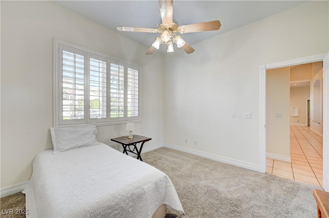 bedroom with light carpet and ceiling fan