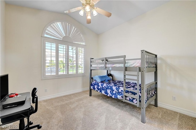 bedroom with ceiling fan, lofted ceiling, and light carpet