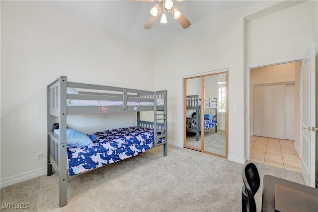 bedroom featuring ceiling fan, carpet floors, and high vaulted ceiling