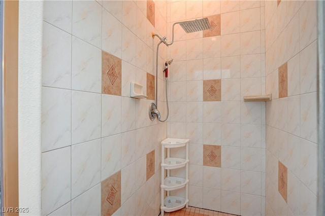 bathroom with a tile shower